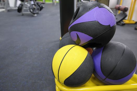 closeup of round dumbbells in the gym