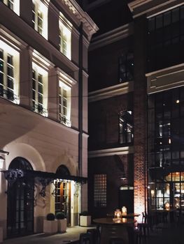 Exterior facade of classic building in the European city at night, architecture and design detail