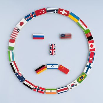 illustration of a smiley face from national flags on dominoes. Concept of peace and the Commonwealth of Nations and the world order