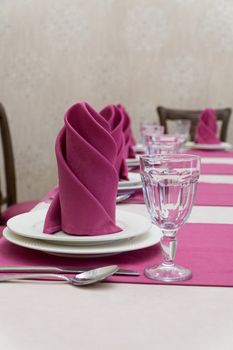 serving banquet table in a luxurious restaurant in pink and white style