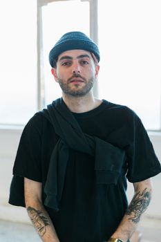 Portrait of young fashionable man in black outfit