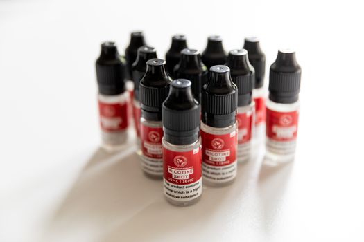 Close up of nicotine shots in bottles for vaping