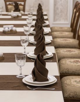 serving banquet table in a luxurious restaurant in brown and white style