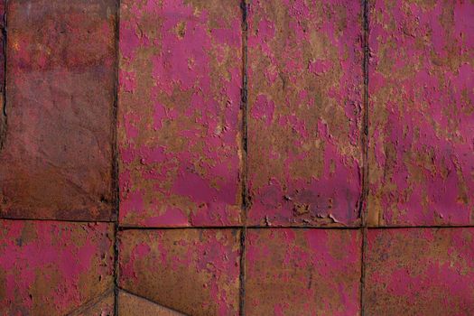rusted tin sheets patchwork wall texture and flat background with peeling leftovers of old pink paint