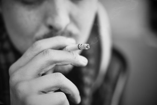 Man smoking cigarette Close up of an smoking cigarette