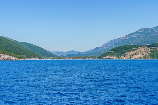 Budva Riviera in Montenegro, view from the sea on a sunny summer day