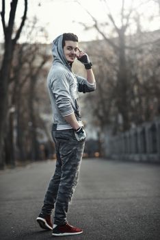 Sporty young man working out at early morning with background sunrise