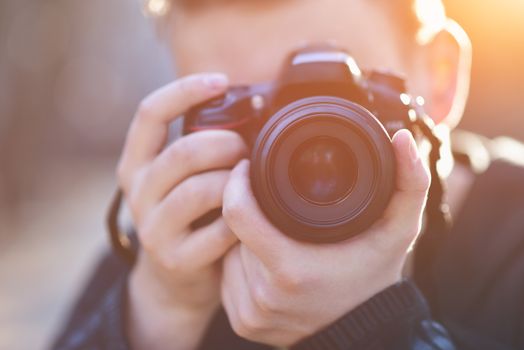 Man with photo camera Fashion Travel Lifestyle outdoor while standing