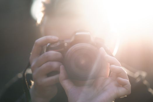 Man with photo camera Fashion Travel Lifestyle outdoor while standing