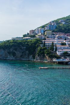 Budva Riviera in Montenegro, view from the sea on a sunny summer day