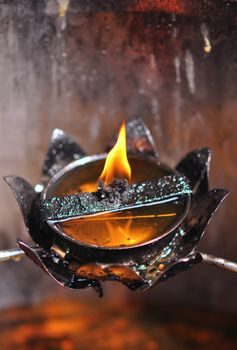 The flame of the oil lamp in the dark, Thai oil lamp.