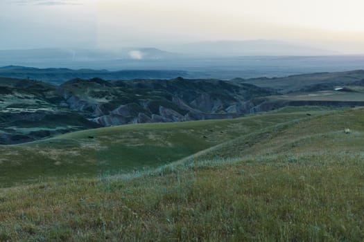 Georgia, the area around the village of Udabno and David Gareja Monastery, which is a UNESCO-listed site. There are only steppes and mountains within 30 km of Udabno. Going to the monastery we can see such views everywhere.