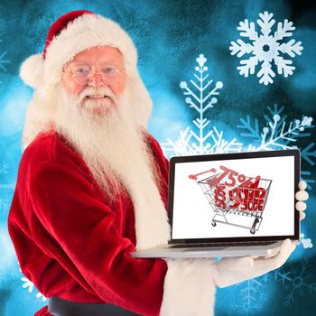 Santa Claus presents a laptop against blue snow flake background