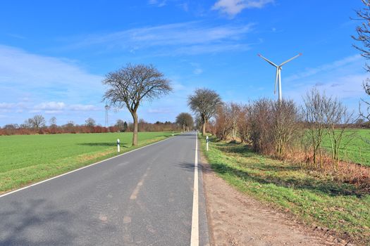 Beautiful view on countryside roads with fields and trees in northern europe.