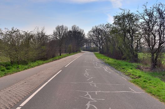 Beautiful view on countryside roads with fields and trees in northern europe.