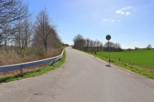 Beautiful view on countryside roads with fields and trees in northern europe.