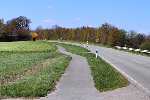 Beautiful view on countryside roads with fields and trees in northern europe.