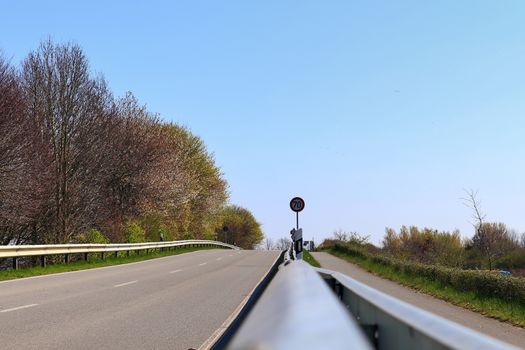 Beautiful view on countryside roads with fields and trees in northern europe.