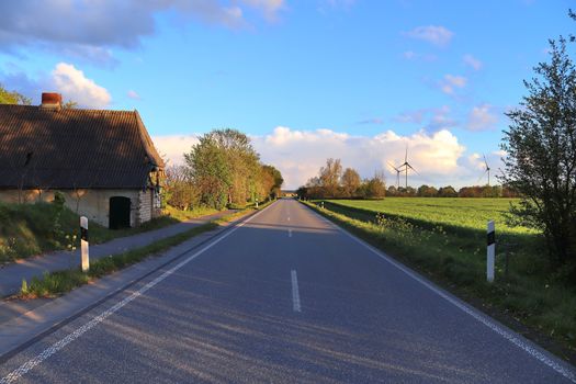 Beautiful view on countryside roads with fields and trees in northern europe.