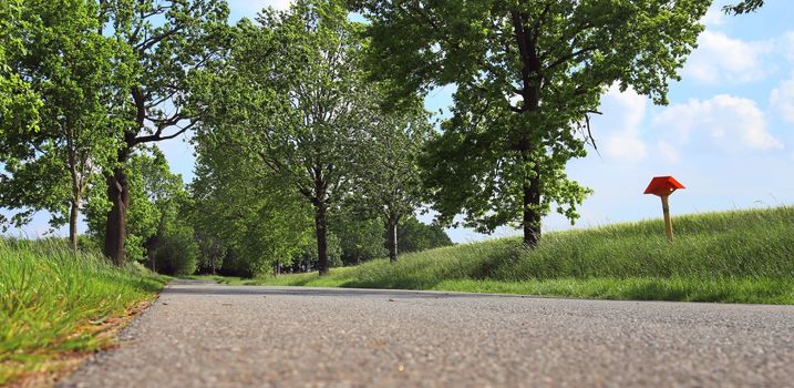 Beautiful view on countryside roads with fields and trees in northern europe.