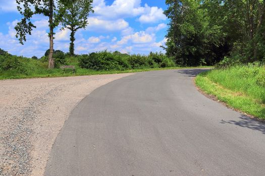 Beautiful view on countryside roads with fields and trees in northern europe.