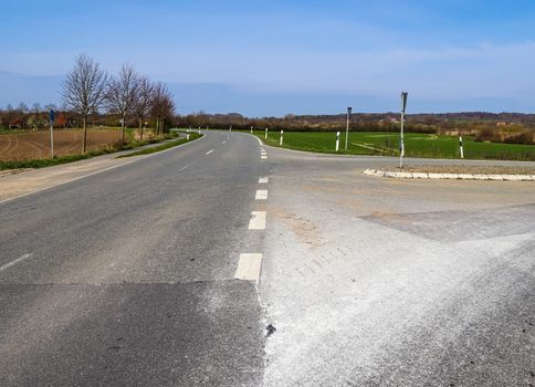 Beautiful view on countryside roads with fields and trees in northern europe.