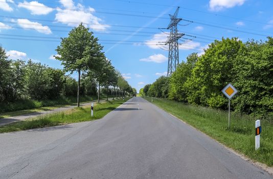 Beautiful view on countryside roads with fields and trees in northern europe.