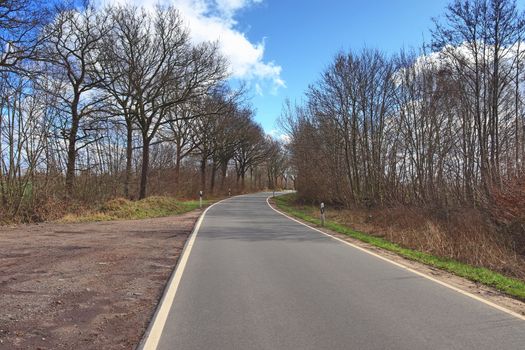 Beautiful view on countryside roads with fields and trees in northern europe.