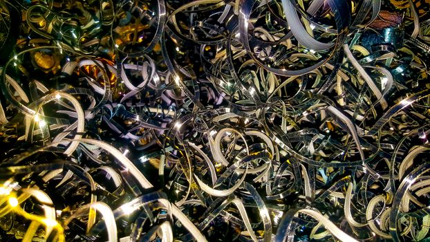 Abstract color background of metal shavings. Processing of ferrous and non-ferrous metals in a factory or factory. Metal background.