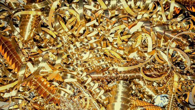 Copper and brass metal shavings, metal sawdust close-up. Abstract color background.