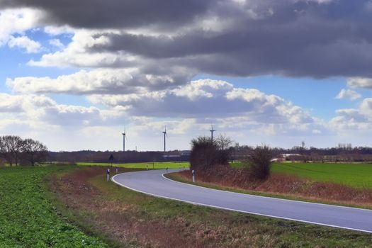 Beautiful view on countryside roads with fields and trees in northern europe.