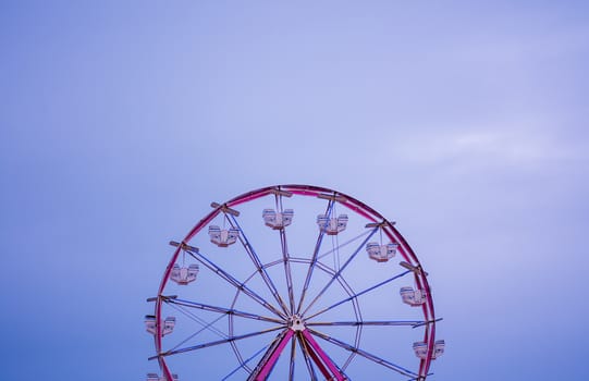 Ferris wheel seen against evening sunset