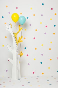 homemade baby beautiful wooden tree with balloons on a white background