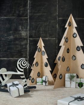 New Year's and Christmas decoration zebra and fir plywood and wood on a dark background