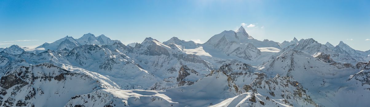 Panorama of the Weisshorn and surrounding mountains in the swiss alps.