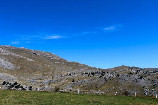 In the background, mountain desolation, with little vegetation. On the way to the mountain Bjelasnica, Bosnia and Herzegovina.