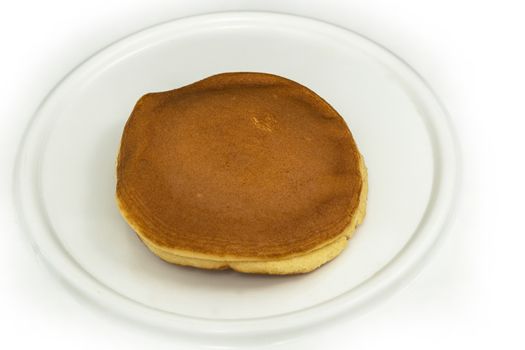 The Dorayaki , Japanese traditional red-bean pancake dessert on white plate