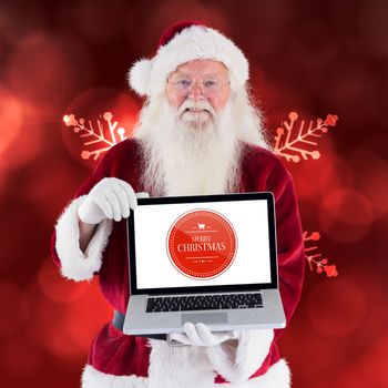 Santa Claus presents a laptop against red snow flake pattern design