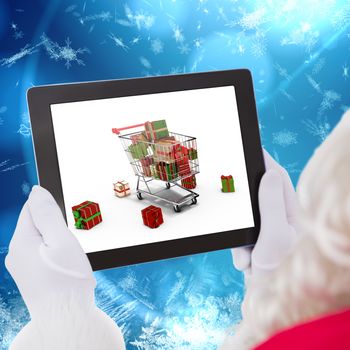Santa claus using tablet pc against blue snow flake pattern design