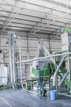 factory equipment for processing and recycling of plastic bottles. PET recycling plant