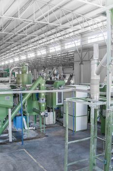 factory equipment for processing and recycling of plastic bottles. PET recycling plant