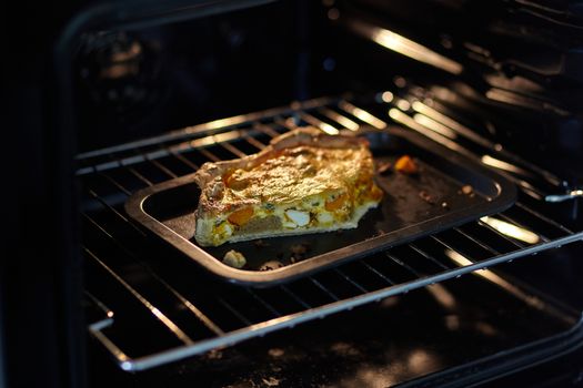 Piece of tart baked in the oven. Small depth of focus.