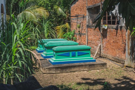 Old graves near an apartment building in southern Vietnam.