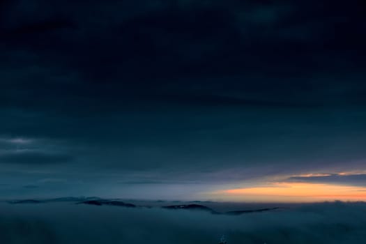 Winter sunset after a storm over the mountains. Beskids, view from the route between Szyndzielnia and Klimczok, Poland