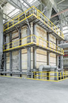 large brick structure with pipes inside the industrial plant