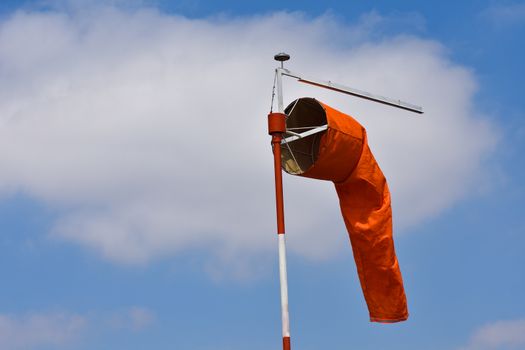 A bright orange wind indication windsock at an airport, Pretoria, South Africa