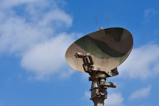 A military radar scanner antenna dish with blue sky, Pretoria, South Africa