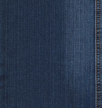Real blue jeans denim texture, background with stitch