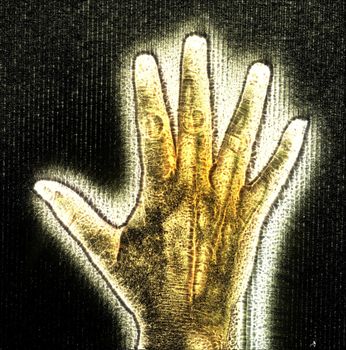 3D-Illustration of a glowing human female hand with a kirlian aura showing different symbols.