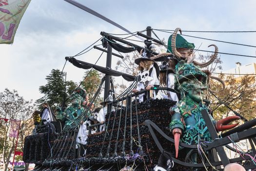 Loule, Portugal - February 25, 2020: Float parading in the street in front of the public in the parade of the traditional carnival of Loule city on a February day